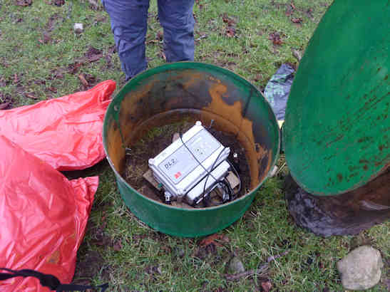Logger recording soil moisture data from buried sensors on the hill slope at Eddleston