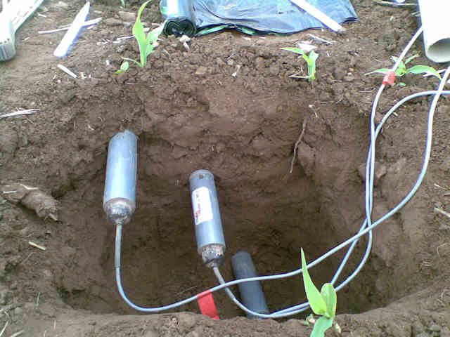 Soil moisture sensors being installed at 20 cm, 30 cm and 60 cm depth beneath the hill slope at Eddleston
