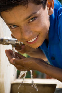 Boy drinking from a tap ©iStockphoto.com/jyoti thakur