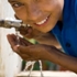 Boy drinking water from tap