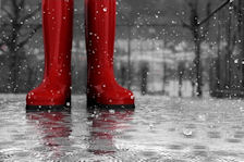 Red wellingtons in the rain ©iStockphoto.com/morkeman