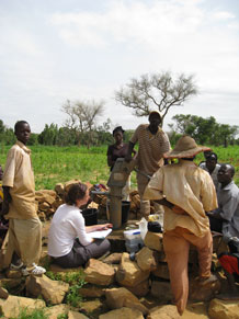 Gathering information on water use and availability with representatives of a village community in Mali, West Africa
